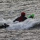 Bellyak rider paddling on the river