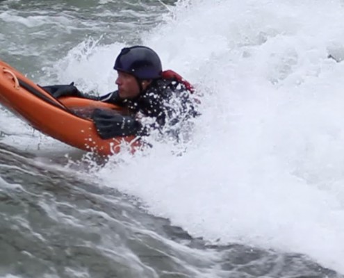 Paddling in the surf on the Bellyak