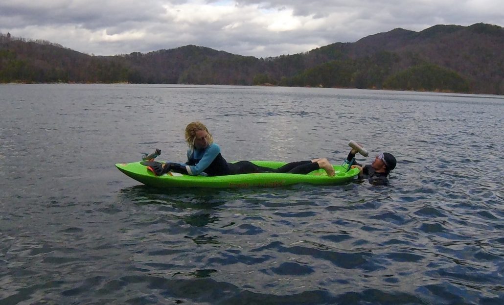 Bellyak serving as a rest station for an open water swimmer